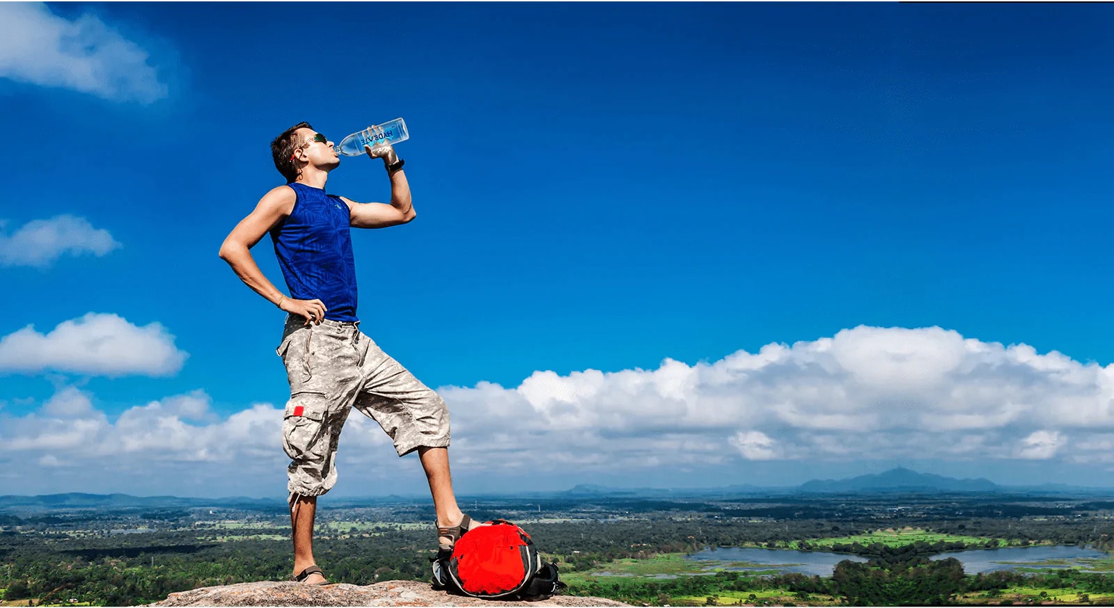 Man Drinking Alkaline Water from Hydrates Water Bottle